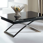Small table extends into a larger table, lowers into a coffee table.